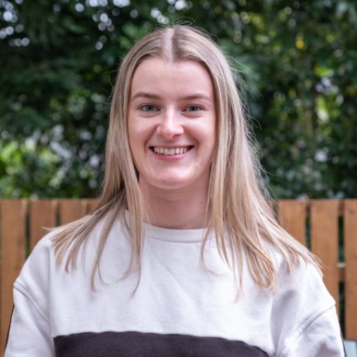 A portrait of a smiling woman looking at camera